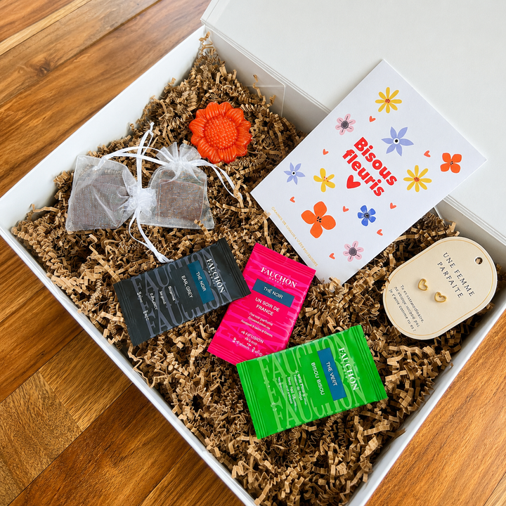 Box Signature Petites Attentions KLycia avec boucles d'oreilles, thés FAUCHON, savon tournesol, graines Bisous Fleuris et gourmandises.